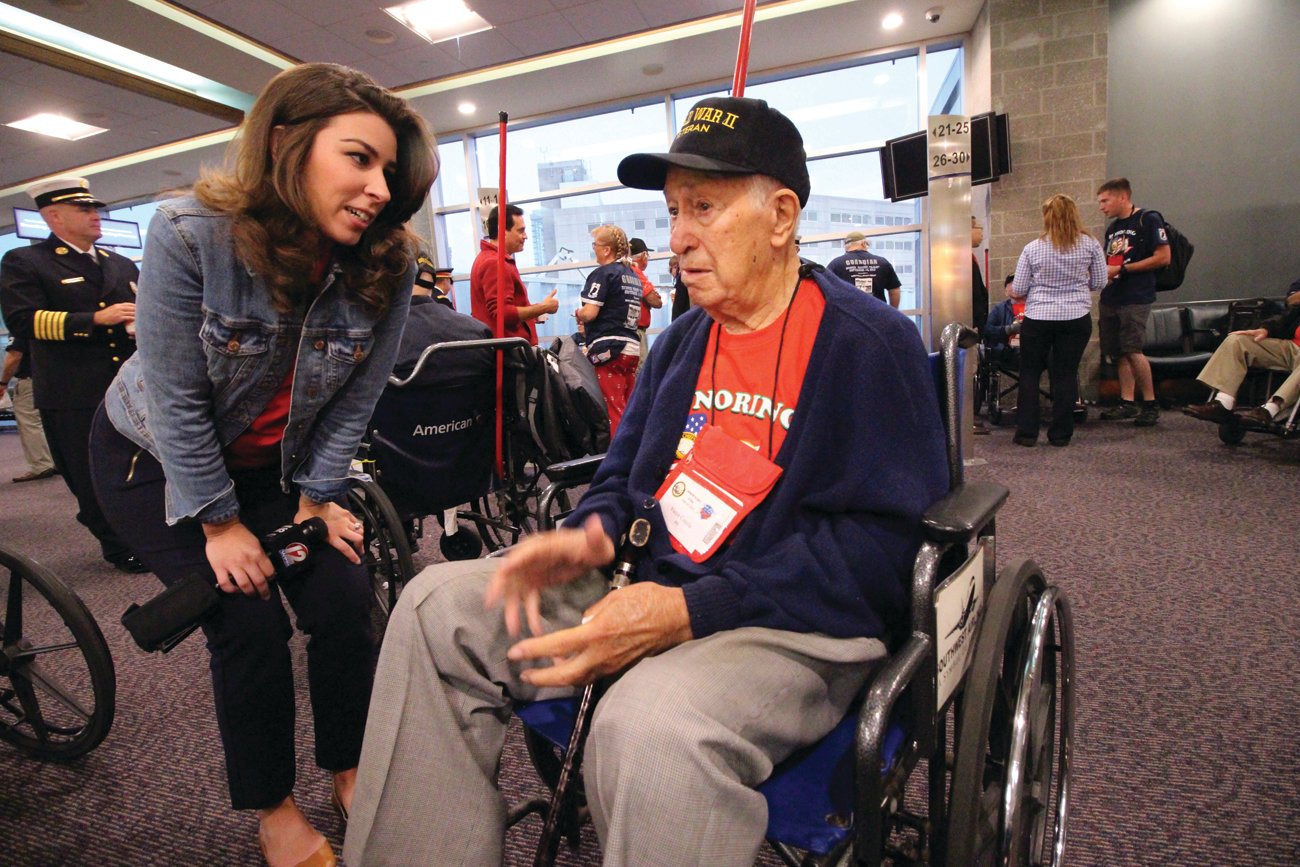 THERE FOR THE INTERVIEW: After seeing a segment of Caught in Providence where WWII veteran Victor Colella  contested a speeding ticket, WPRI reporter Kim Kalunian was sure to interview the Johnston resident before he left on Saturday’s Honor Flight.